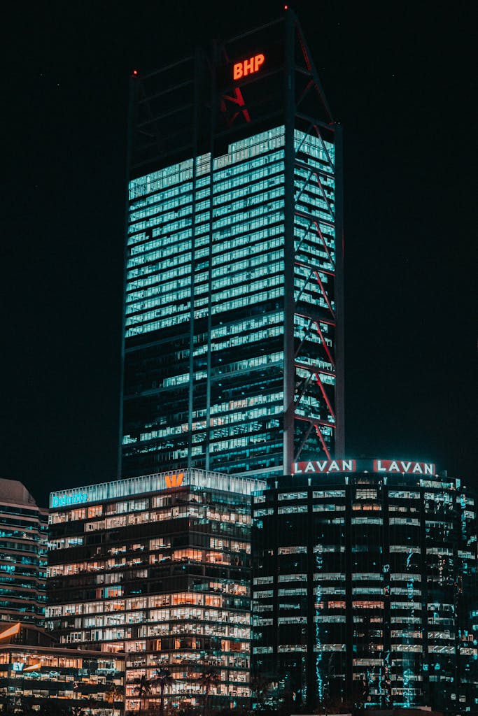 Night view of the iconic BHP building with city lights in Perth, Australia.